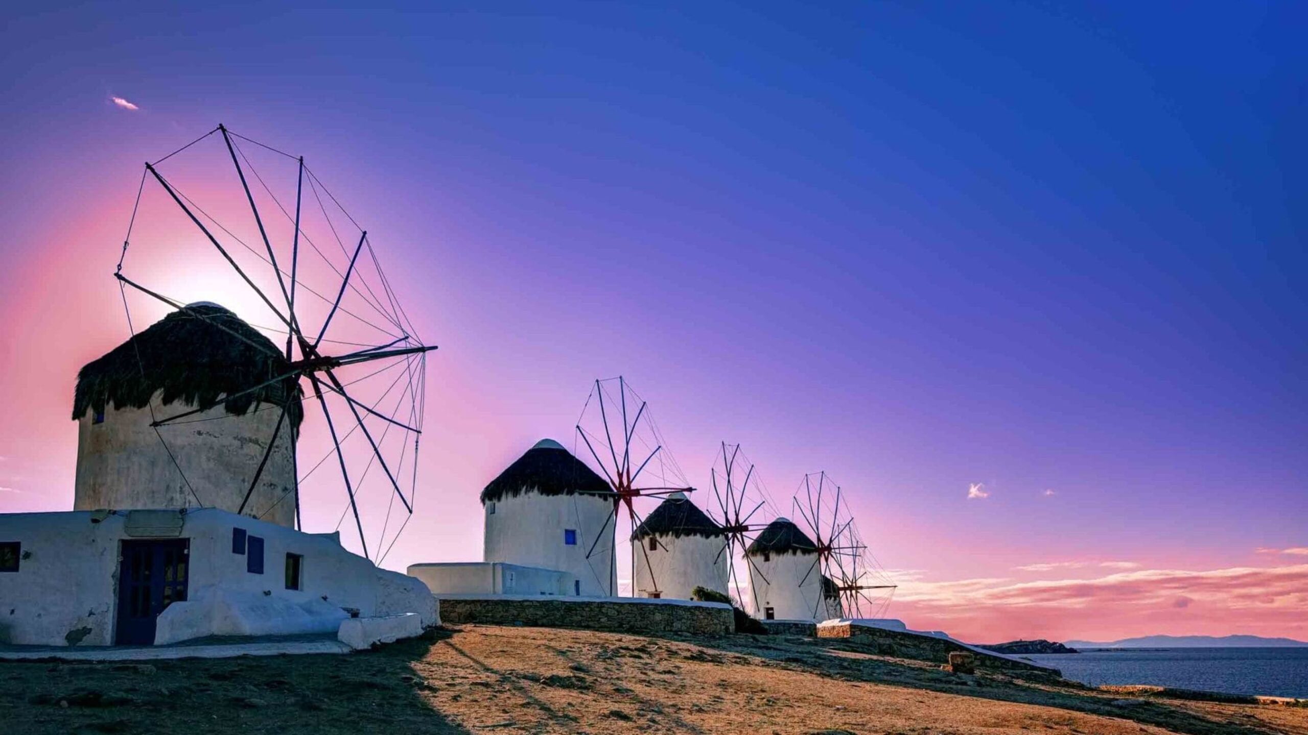 Traditional,Windmills,,The,Symbol,Of,Mykonos,At,Sunset,,Greece Traditional windmills, the symbol of Mykonos at sunset, Greece